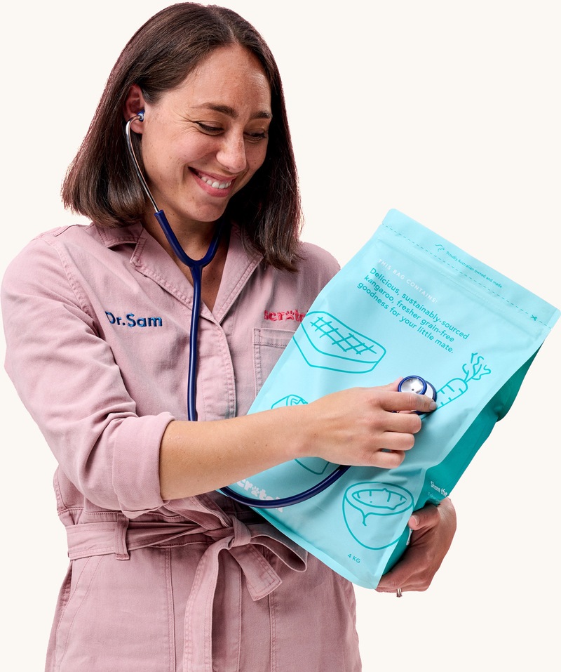 Dr Sam hugging bag of Kangaroo