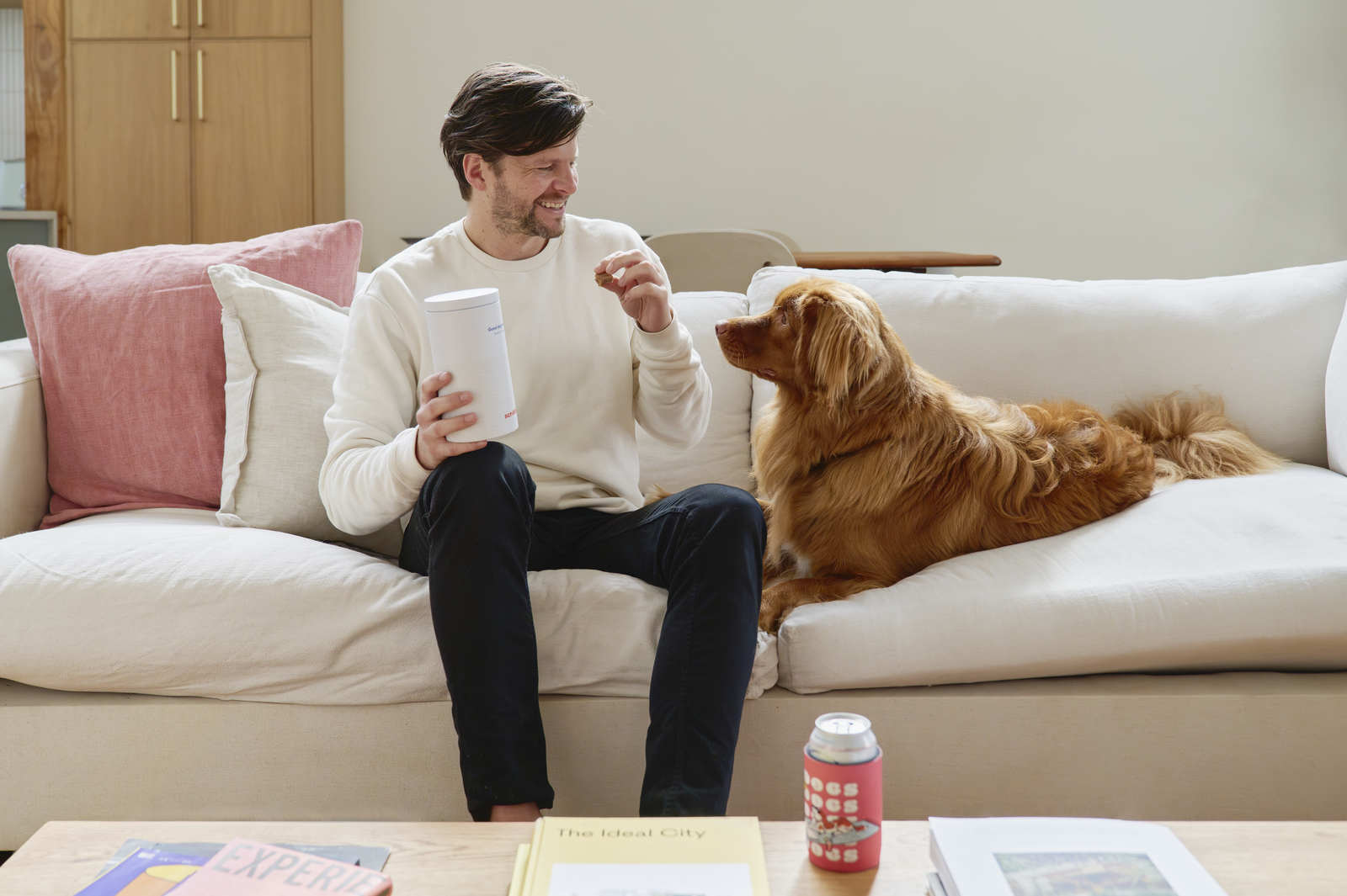 Giving jerky treat to dog