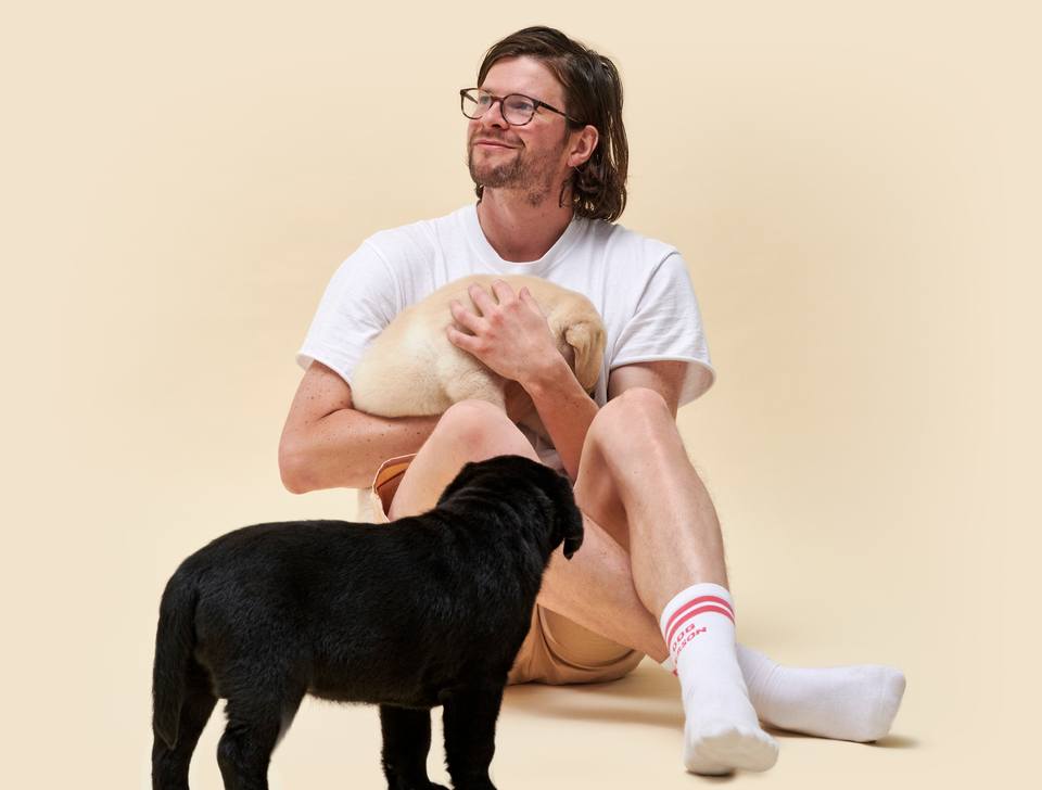 Man holding puppies